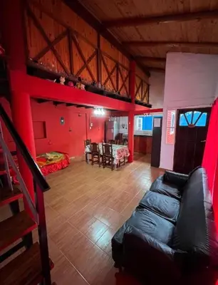 a room with a loft bed and a living room at La Morada in Mina Clavero