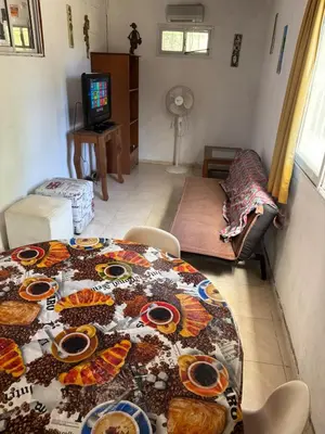 a living room with a table with food on it at Casa Mirador Del Lago in Villa Parque Siquiman