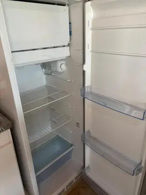 an empty refrigerator with its door open in a kitchen at Casa Mirador Del Lago in Villa Parque Siquiman