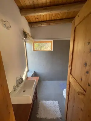 a bathroom with a sink and a toilet in it at Cabaña Peperina in San Javier
