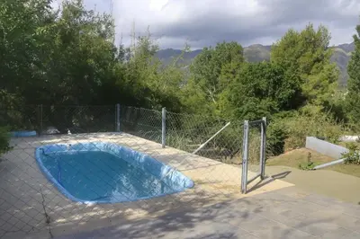 a fenced in swimming pool with a fence at Quiya ná in Cortaderas