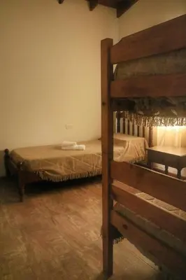 a bedroom with two bunk beds in a room at Quiya ná in Cortaderas