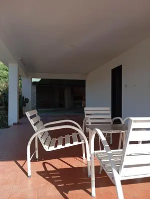 two chairs and a table on a patio at Casa Lago Azul in Villa Santa Cruz del Lago