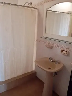 a bathroom with a sink and a mirror at Casa Lago Azul in Villa Santa Cruz del Lago
