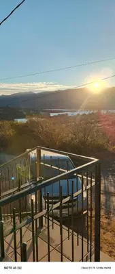 a view of the ocean from a balcony with a bench at Hermosa Casa para 6 personas en Parque Siquiiman Cordoba in Villa Parque Siquiman