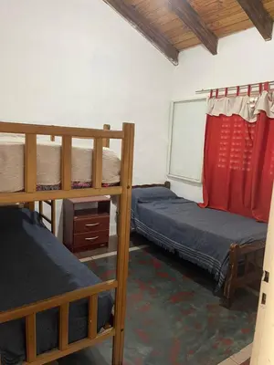 a room with two bunk beds and a window at Cabañas Doña Chicha - San Clemente, Córdoba in San Clemente