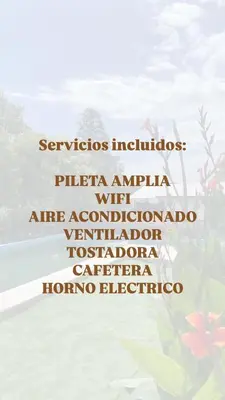 a group of words on a window with flowers at Mi casita en Embalse in Embalse