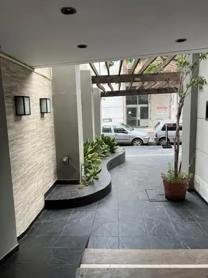 a lobby of a building with a parking lot at Portal de la Cañada in Cordoba