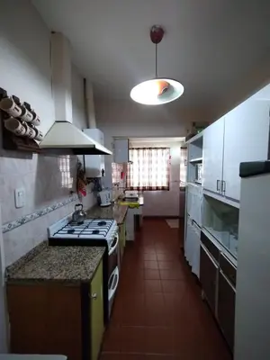 a kitchen with a stove top oven in a room at Casa en VCP a la vuelta de la Costanera in Villa Carlos Paz