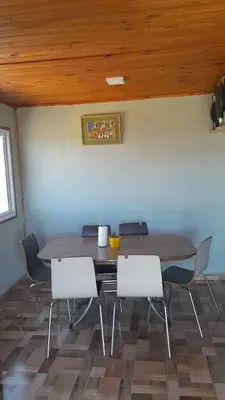 a dining room with a table and chairs at Rincon de Bialet in Bialet Massé