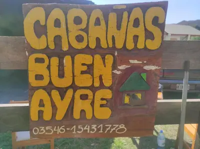a sign that says cargos burn alive at Ikigai alojamiento con piscina in Villa Rumipal