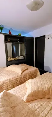 a bedroom with two beds and a headboard at El Valtodano in Cordoba