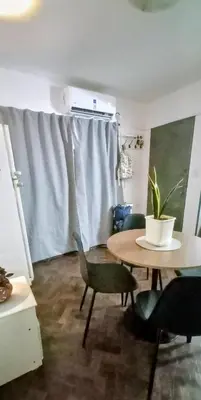 a room with a table and chairs and a window at El Valtodano in Cordoba