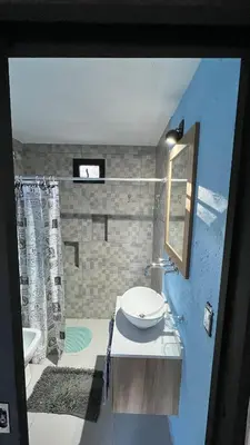 a bathroom with a sink and a mirror at Altos de Lagunitas in Villa General Belgrano