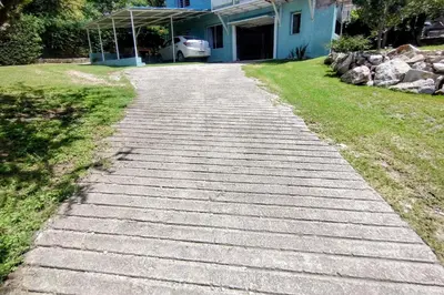 a stone path in front of a house at La casa del Algarrobo in San Antonio de Arredondo