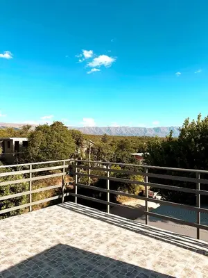 a balcony with a view of the mountains at La Herradura in Mina Clavero