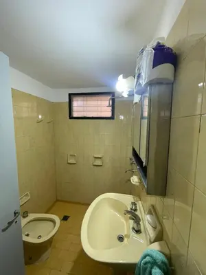 a bathroom with a sink and a toilet at casita Playas de oro in Villa Carlos Paz