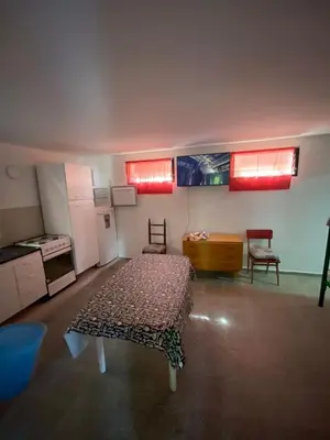 a room with a table and two chairs in it at casita Playas de oro in Villa Carlos Paz