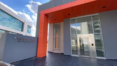 a building with a sign on the side of it at Departamento 1 dor ciudad gama seguridad 24h pileta calidad in Cordoba