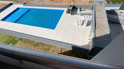 an overhead view of a swimming pool on a roof at Departamento 1 dor ciudad gama seguridad 24h pileta calidad in Cordoba