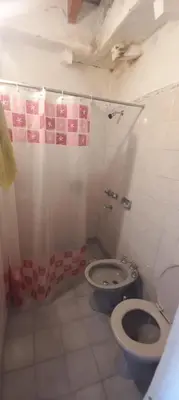 a bathroom with a toilet and a shower at Malvinas Departamento in Villa Carlos Paz