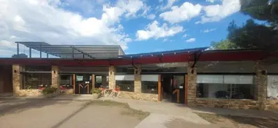 a large brick building with a roof at Posada Miralejos in Trapiche