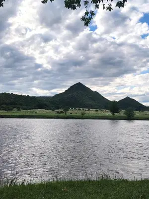 a large body of water with mountains in the background at Cabaña Valle del alma in Nono