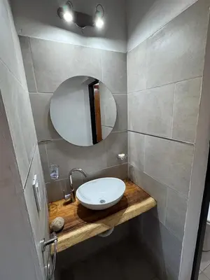 a bathroom with a sink and a mirror at Cabaña Valle del alma in Nono