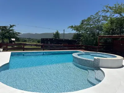 a large swimming pool with a circular poolvisor at La Fortaleza in Villa Parque Siquiman