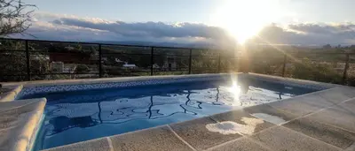a swimming pool with a picture of a elephant painted on it at Cabañas La Puesta del Sol in Estancia Vieja