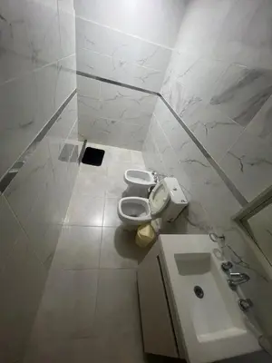 a bathroom with a toilet and a sink at La casa accesible y perfecta para tus vacaciones in Villa Santa Cruz del Lago