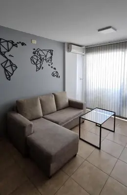 a living room with a couch and a coffee table at Depto Moderno, Luminoso y Cerca de Todo Córdoba in Cordoba