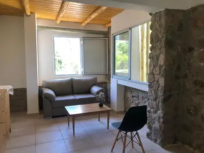 a living room with a couch and a table at Casa Titi in Arroyo de Los Patos
