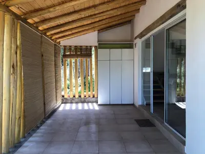 an empty hallway of a house with a wooden ceiling at Casa Titi in Arroyo de Los Patos