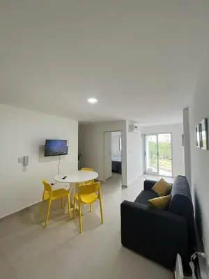 a living room with a couch and a table at Departamento en General Paz I in Cordoba