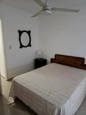 a bedroom with a bed and a ceiling fan at Complejo NOVIEMBRE in Cordoba