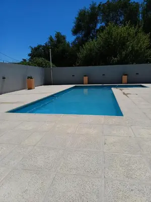 a swimming pool in the middle of a patio at Complejo NOVIEMBRE in Cordoba