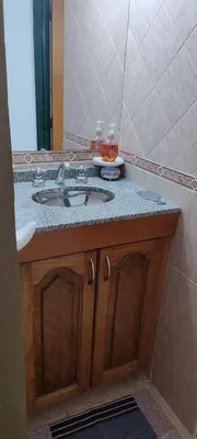 a bathroom with a sink and a mirror at Casa Villa Carlos paz in Villa Carlos Paz