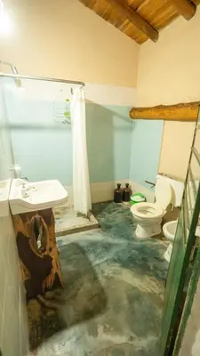 a bathroom with a sink and a toilet at Cosmoqui Casa Boutique in Villa de Las Rosas