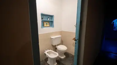 a bathroom with a toilet and a urinal at Cosmoqui Casa Boutique in Villa de Las Rosas