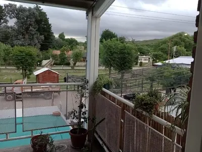 a balcony with a view of a farm at Cabañas Sprinter in Trapiche