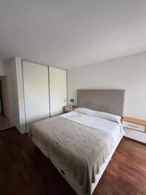 a bedroom with a large bed in a room at Departamento - Complejo Casonas de Manantiales in Cordoba