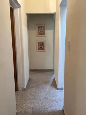an empty hallway with two pictures on the wall at Casa 7 Cajones in Trapiche