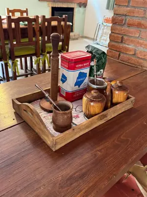a wooden tray with cups on a table at Casa 7 Cajones in Trapiche