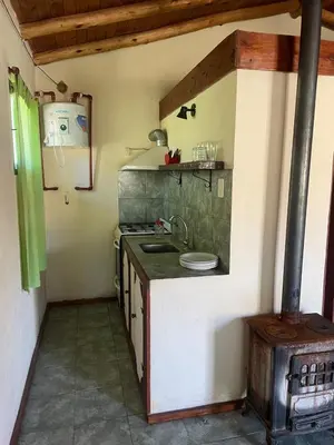 a kitchen with a sink and a stove at Camino de Santidad in Piedras Blancas