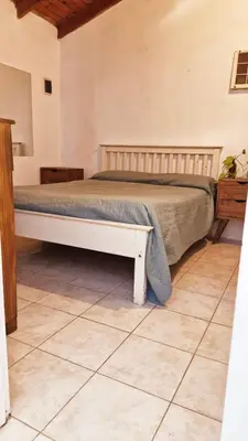 a bed in a room with a bed sidx sidx sidx at Rohvolk chill aparts in Villa General Belgrano