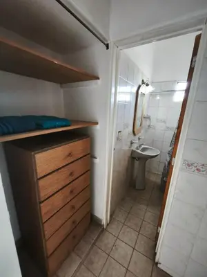 a small bathroom with a sink and a toilet at Dpto Villa Carlos Paz max 5 personas