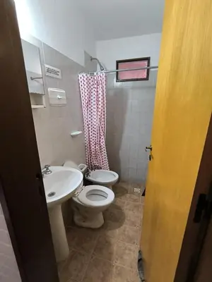 a bathroom with a toilet and a sink at Sweet Angel in Villa Cura Brochero