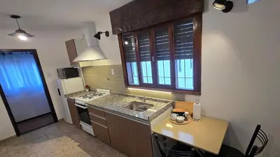 a kitchen with a sink and a counter top at Temporario HOSPITAL PRIVADO, QUALITY, con cochera en CORDOBA in Cordoba