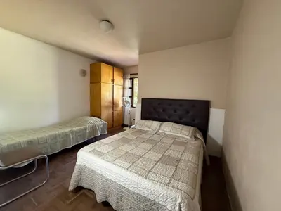 a bedroom with two beds in a room at Casa TOKIO in Villa Carlos Paz